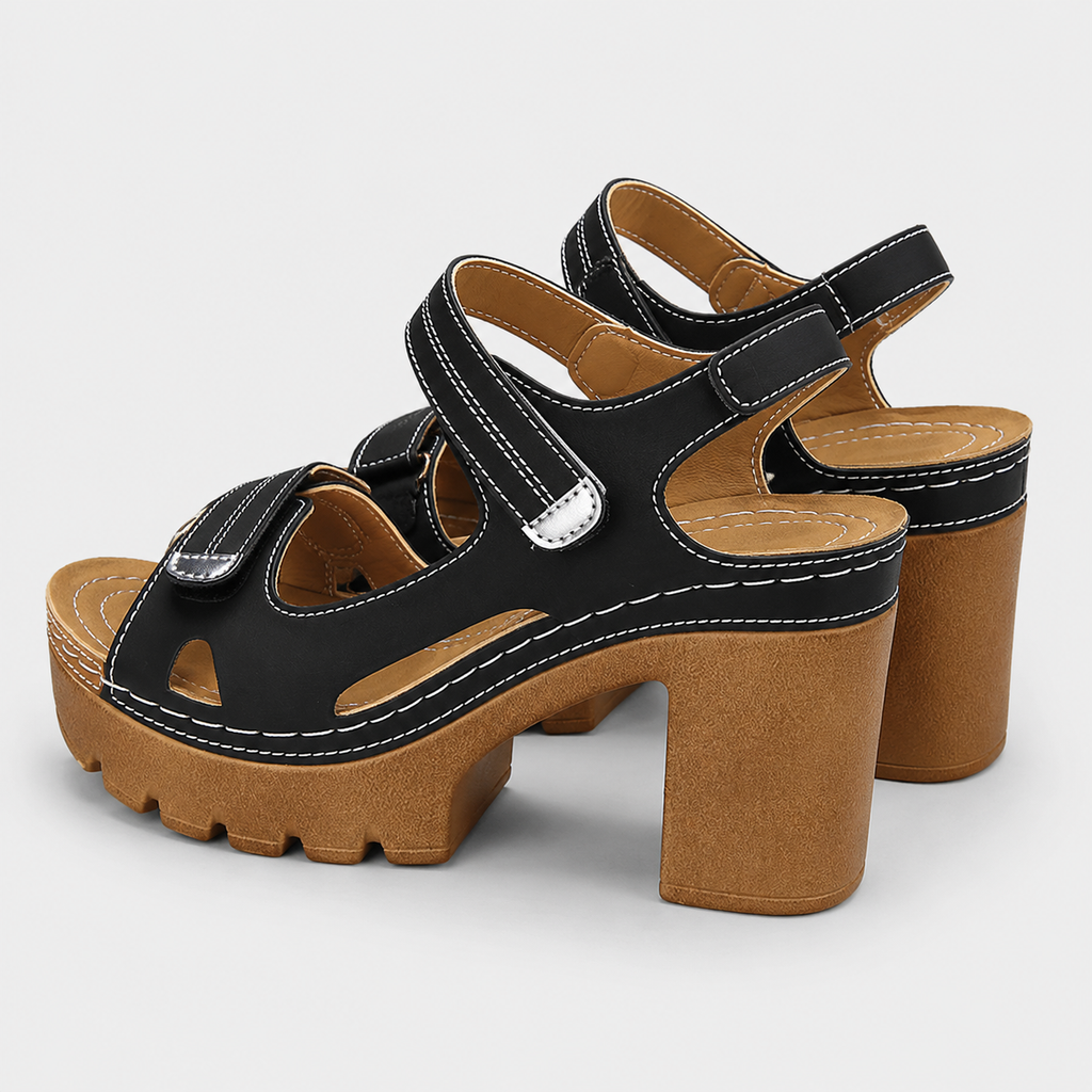 Black and brown platform sandals with chunky block high heels and adjustable hook and loop ankle straps.